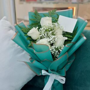 Hand bouquet white roses with green cover